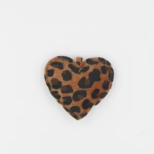 Detailed close-up view of a leopard print heart shaped plush keychain charm accessory.