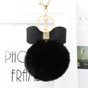 Black faux fur bow pompom keychain bag charm, fluffy ball keyring fashion accessories.