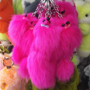 Fluffy hot pink fox plush keychain pompom bag charm cute furry animal key ring pendant.