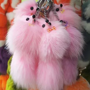 Fluffy pink fox plush keychain bag charm and cute fluffy animal pendant for keys.
