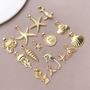 Gold plated marine theme jewelry pendants detail view, sparkling zircon starfish charms for DIY crafts.