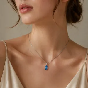 Minimalist 925 sterling silver clavicle chain featuring a clear marquise blue gemstone pendant.