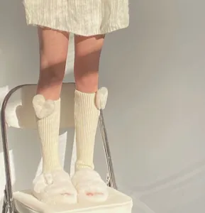 Autumn winter knitted leg warmers with fluffy heart decoration, cozy thermal calf sock covers.
