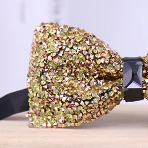 Exquisite rhinestone crystal bowtie detail, sparkling gold design for wedding groom fashion.