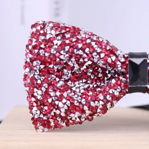 Sparkling red crystal rhinestone bow tie close-up detail for men wedding party suit.