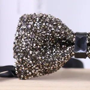 Crystal studded bow tie detail view, sparkling rhinestone men's formal neckwear for wedding party.