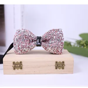 Sparkling crystal bow tie detail, elegant pink rhinestone bow for men's formal wedding suit.