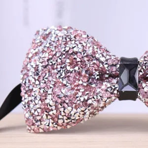 Close-up detail of sparkling pink and silver crystal rhinestone men's bow tie accessory.