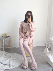 Detailed view of women's soft pink matte solid color tights, seamless design for autumn winter.