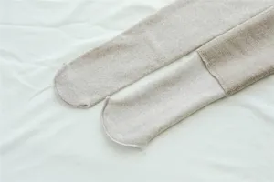 Detail view of winter fleece lined oatmeal beige ribbed tights, soft and warm base layer socks.