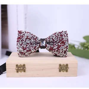 Detailed view of the sparkling crystal rhinestone bow tie in wine red for men's formal wear.