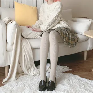 Detail view of oat beige vertical striped ribbed fleece-lined tights for winter wear.
