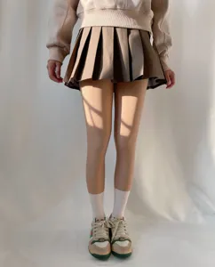 Detail view of fleece-lined fake translucent tights showing natural skin tone effect and fit.
