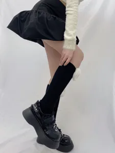 Black ribbed leg warmers with fluffy heart decor, trendy winter knit sock covers