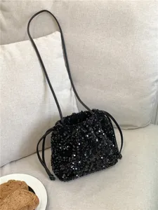 Sac seau a paillettes noir pour femme, sac bandouliere brillant avec lien de serrage.