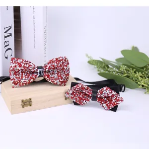 Wine red 3D crystal rhinestone men's bowtie detail, elegant wedding suit accessory.