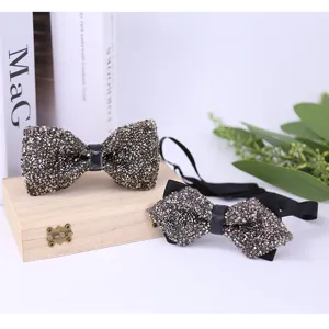 Crystal rhinestone bow tie detail shot, showcasing sparkling crystal embellishment and elegant black strap.
