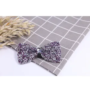 Sparkling purple rhinestone bow tie close-up, crystal bow detail view for formal menswear.
