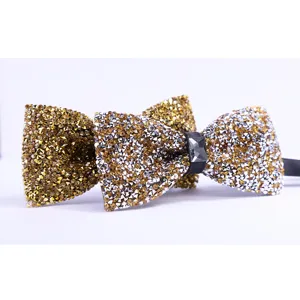 Exquisite crystal rhinestone bow tie detail, sparkling gold and silver design for formal events.