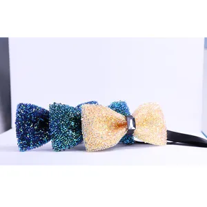 Detailed close-up of sparkling crystal rhinestone bow tie featuring vibrant multi-color stones.