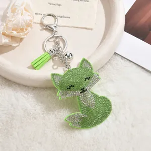 Green rhinestone fox keychain detailed view, featuring sparkling crystal stones and cute tassel pendant.