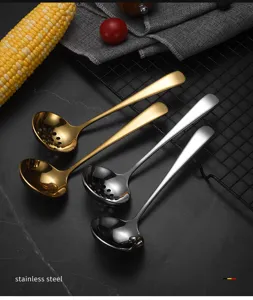 Detailed view of stainless steel hot pot soup spoons and colanders in gold and silver finishes.