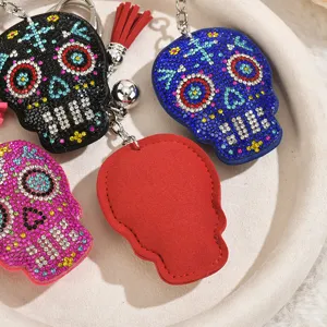 Rhinestone skull keychain bag charm, sparkling crystal halloween gothic accessory gift.