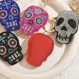 Rhinestone skull keychain, sparkling crystal bag charm, trendy Halloween punk accessory.