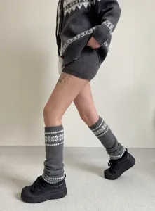 Chauffe-jambes en tricot douillet pour l'automne et l'hiver avec un joli motif flocon stylé.