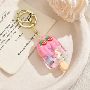 Cute strawberry popsicle keychain with quicksand charm, perfect bag accessory and lovely gift.