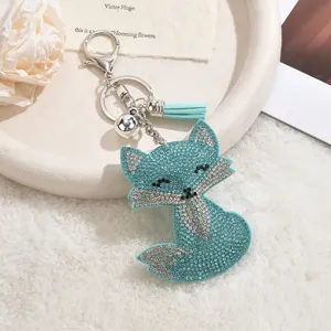 Blue rhinestone fox keychain with tassel pendant, cute glitter bag accessory and keyring.