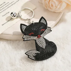Cute black rhinestone fox keychain and bag pendant, sparkling crystal fashion accessory gift.