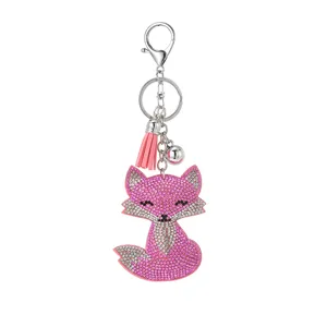 Cute rhinestone pink fox keychain with tassel, stylish metal bag charm and accessory for women.
