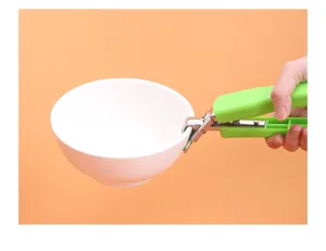 Stainless steel anti-scalding bowl clamp detail view, ergonomic green handle for kitchen use.