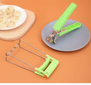 Multi-functional anti-scald bowl clip detail view, stainless steel kitchen dish gripper tool.