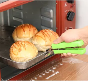 Stainless steel anti-scalding clip detail view, green handle pot gripper for kitchen.