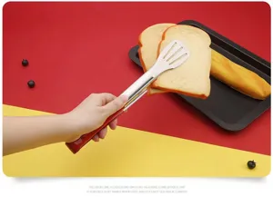 Stainless steel kitchen food tongs with red handle for bread, steak, and BBQ cooking use.