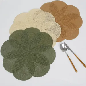 Detailed view of woven petal placemats, natural heat insulation dining table mat.