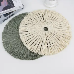 Round paper woven placemat with fringe tassel design, non-slip table mat for home decor.