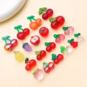 Detailed view of assorted miniature acrylic fruit charms for DIY handmade jewelry accessories.