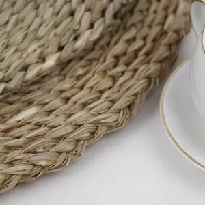Close-up detail of natural woven seagrass placemat texture, handcrafted table decor.