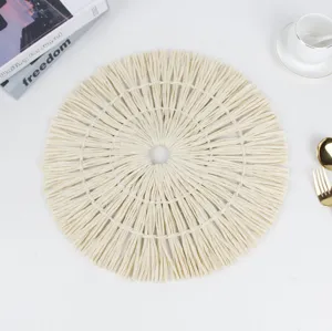 Round paper woven placemat with tassel edge, elegant table mat for home decor and dining.