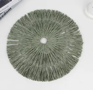 Round paper woven placemat with fringe texture, stylish table decor for dining and home use.