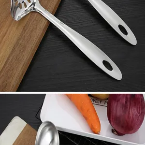 Stainless steel slotted spoon detail view kitchen cooking utensil skimmer tool for home.