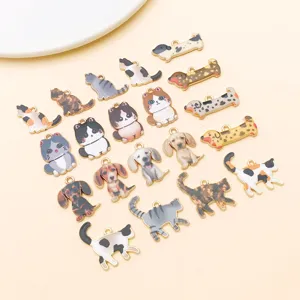 Close-up detail of cute cat and dog enamel alloy charms for DIY handmade jewelry accessories.