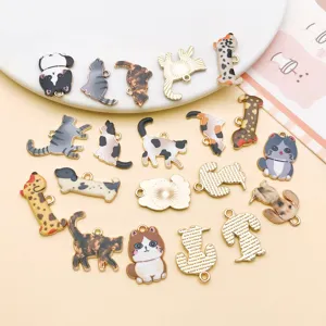 Close-up detail of assorted enamel cat and dog alloy charms for DIY jewelry making and crafts.