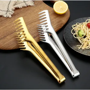 Stainless steel comb-shaped food tongs detail view, elegant gold and silver finish for kitchen.