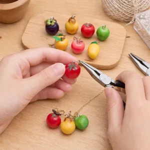 Resin fruit pendant detail view, handmade DIY jewelry accessory featuring cute miniature charms.
