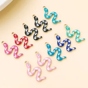 Close-up of colorful enamel snake charms for DIY jewelry making, featuring assorted vibrant tones.