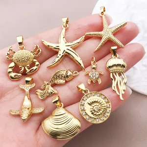 Close-up of 18k gold plated ocean charms including starfish and shells for DIY jewelry making.